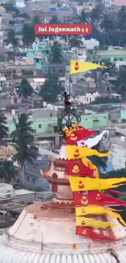 Temple adorned with colorful flags overlooking urban skyline.