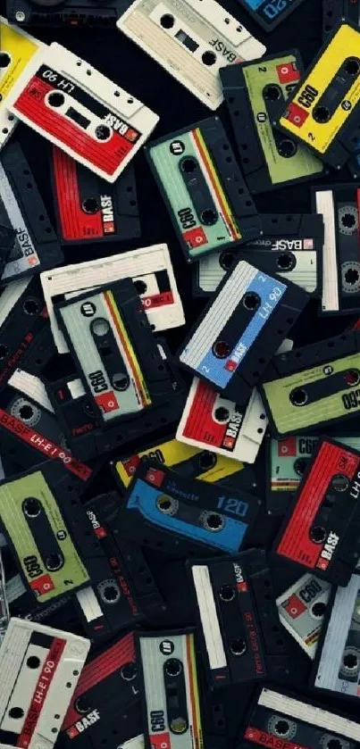 Vibrant mobile wallpaper with colorful vintage cassettes on a black background.