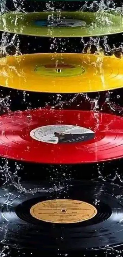 Colorful vinyl records with water splash on black background.