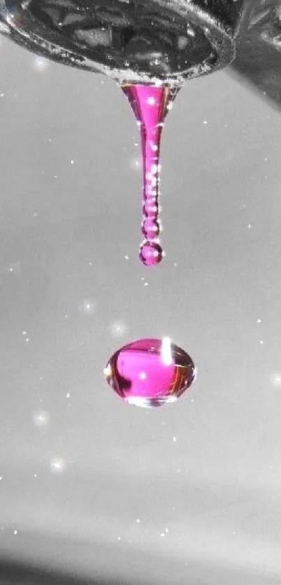 Mobile wallpaper with magenta water drop.