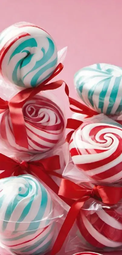 Vibrant candies with red and teal swirls in clear wrapping and red ribbons.