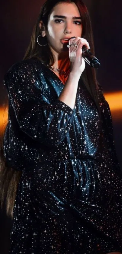 Glamorous singer performing live on stage under vibrant lights.