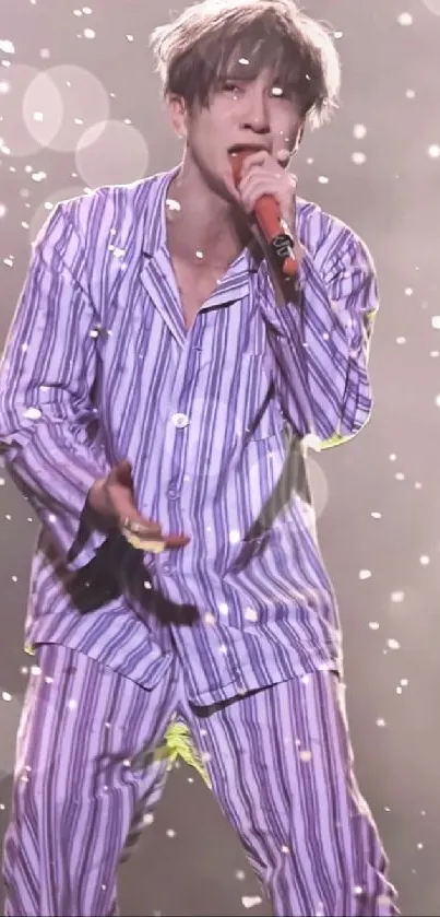 Performer in vibrant purple striped suit on stage.