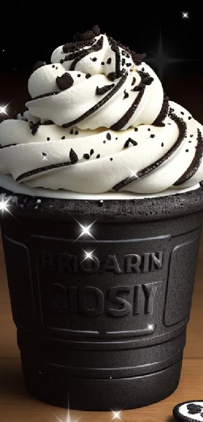 Black cup with cookies and cream swirl topped with chocolate.