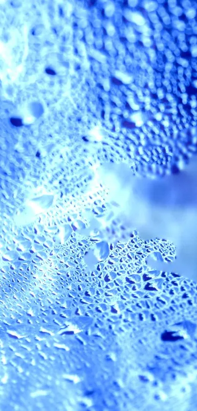 Abstract blue wallpaper with water droplets and textured patterns.