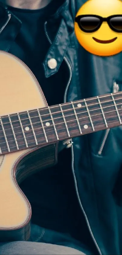 Person in leather jacket playing acoustic guitar with cool emoji face.
