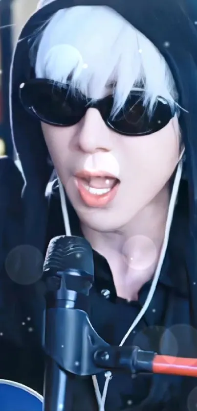 Stylish musician in black hoodie with sunglasses performing.