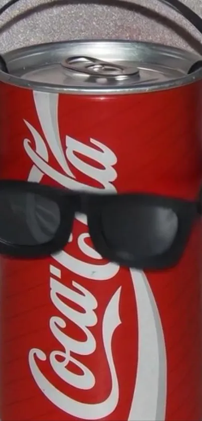 Soda can with sunglasses and headphones on wallpaper.