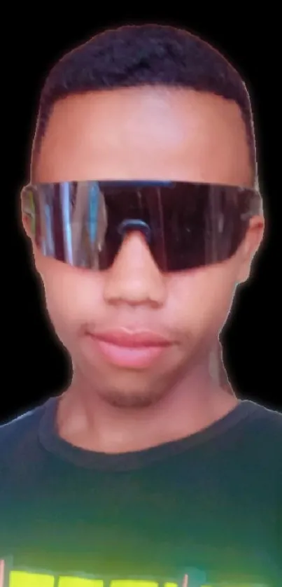 Young adult wearing futuristic sunglasses on a black background.