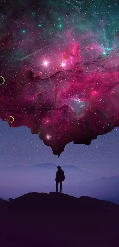 Silhouette beneath vibrant cosmic galaxy in mobile wallpaper.