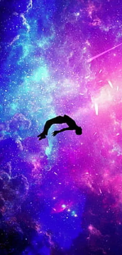 Silhouette diving into a vibrant cosmic nebula wallpaper.