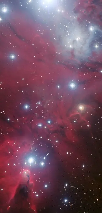 Vibrant red and blue cosmic nebula wallpaper with twinkling stars.