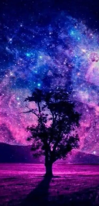 Galactic night sky with a silhouetted tree and vibrant colors.