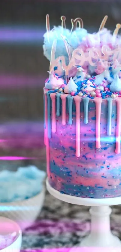 Colorful cotton candy-themed drip cake with pink and blue swirls.