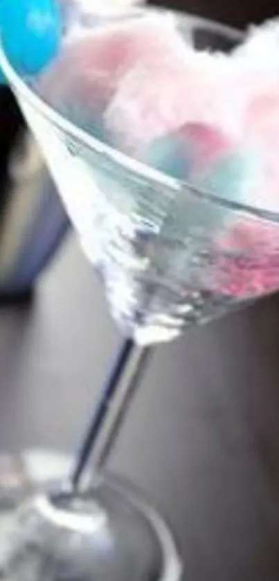 Martini glass with cotton candy decoration.