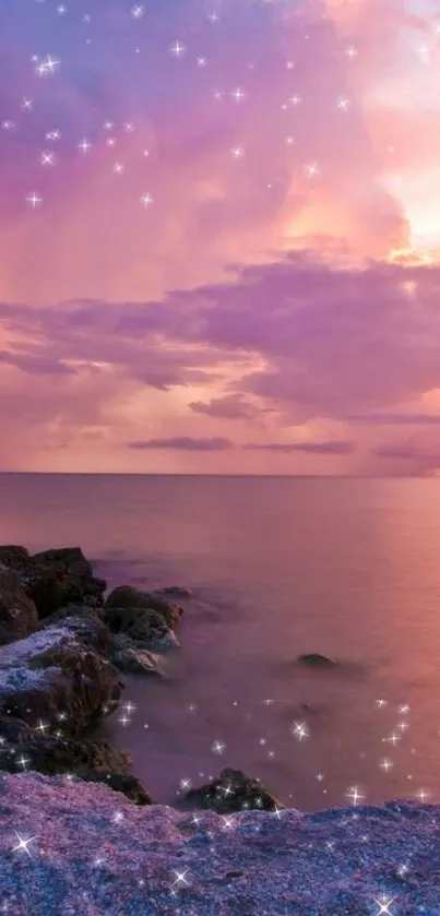 Pink sunset over ocean with rocks and stars shimmering.