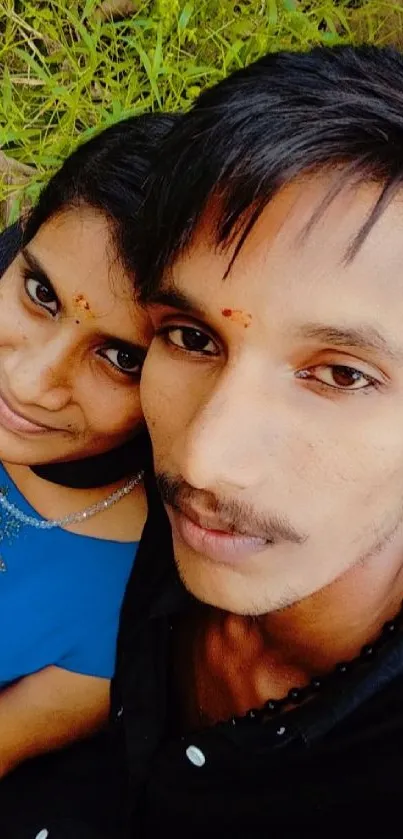 Cheerful couple posing for a selfie outdoors.