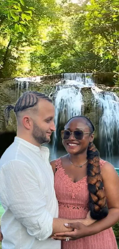 Romantic couple by a lush waterfall in nature's embrace.