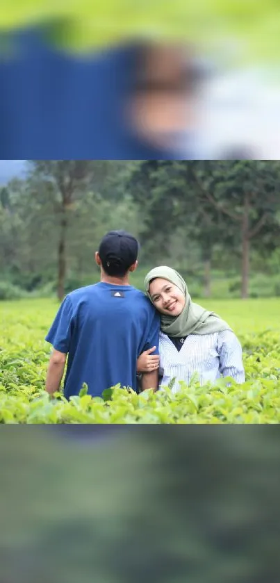 Happy couple enjoying a green field landscape.