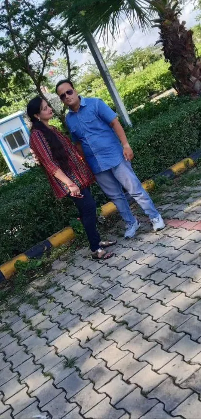 Couple enjoying a park walk on a sunny day.