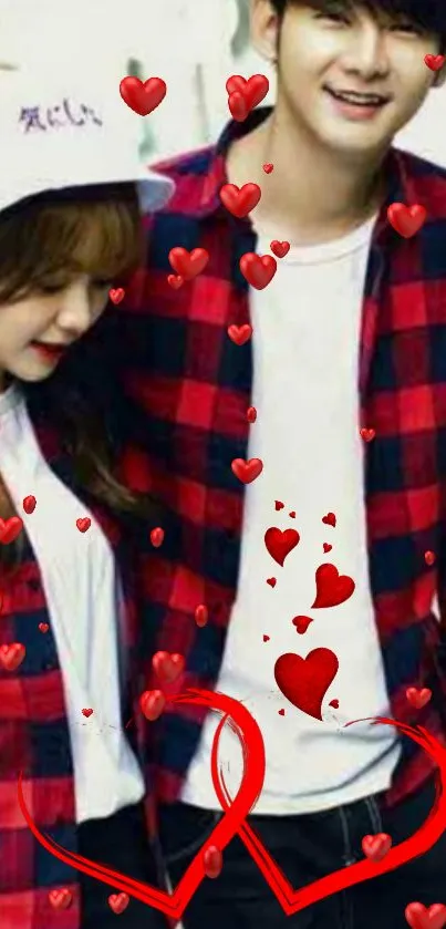 Couple in matching outfits with floating red hearts.