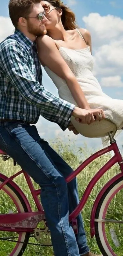 Romantic couple riding a pink bicycle under a blue sky.