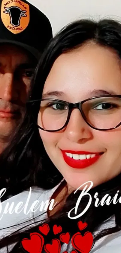 Couple portrait with red lipstick and black glasses.