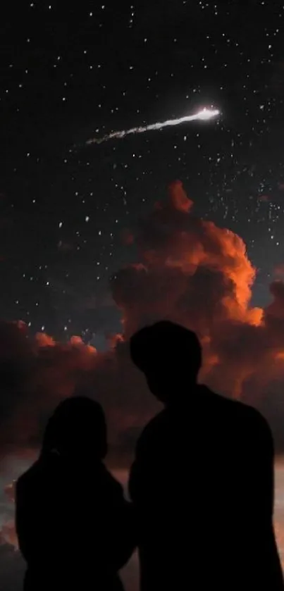 Silhouetted couple under starry sky with orange clouds.