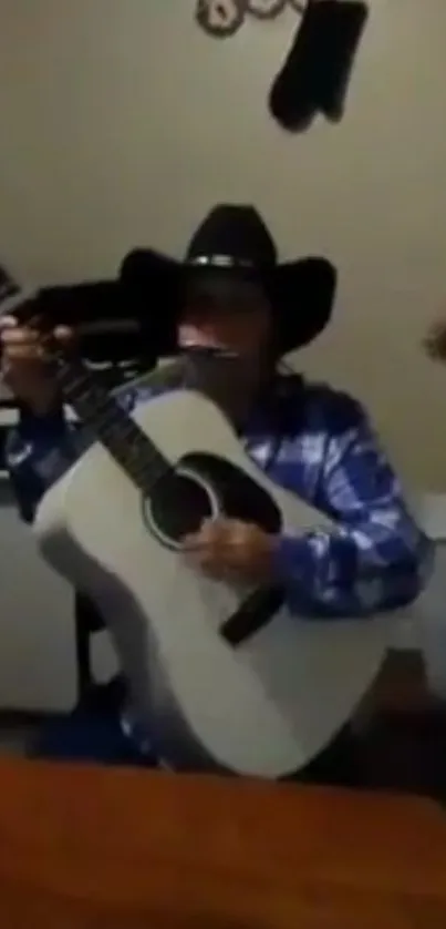 Cowboy playing guitar with harmonica in rustic setting.