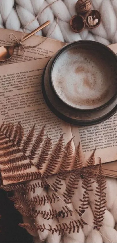 Cozy coffee cup on open books with autumn leaves.