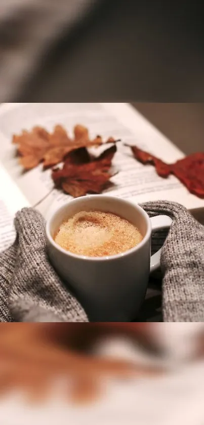 Cozy autumn scene with coffee, book, and fall leaves.