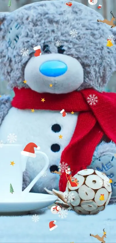 Teddy bear with red scarf and cup in a winter scene.