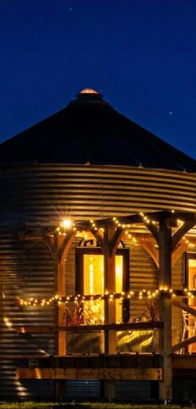 Cabin with glowing lights under a starry night sky.