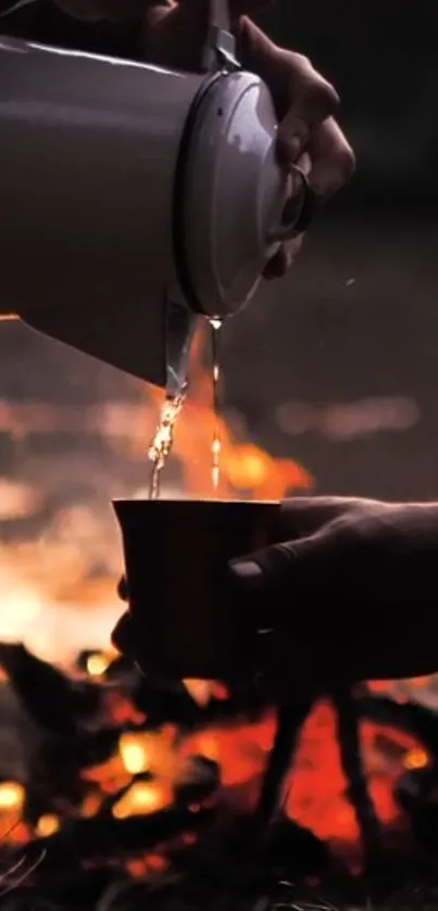 Silhouette of pouring coffee by campfire at dusk.
