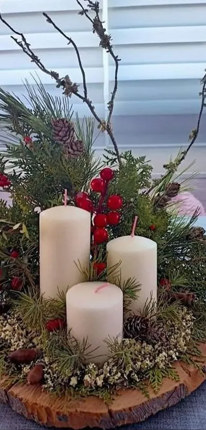 Holiday candles with pine branches on rustic table.