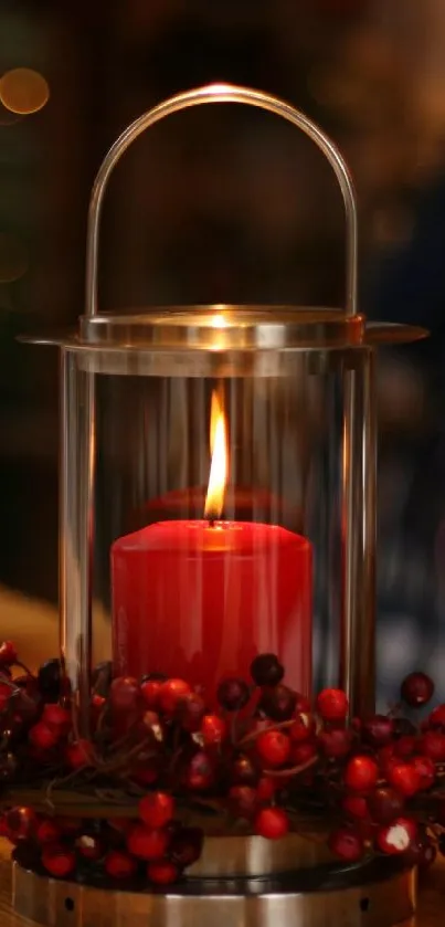 Festive lantern with red candle and berries creating cozy ambiance.