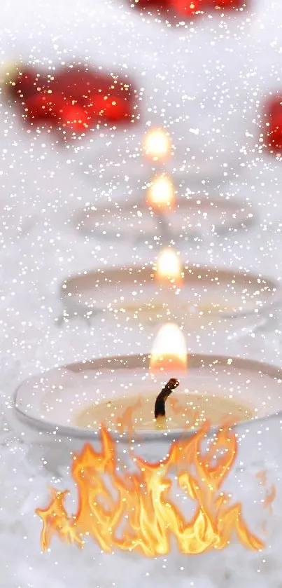 Burning candles lined up on a snowy backdrop with subtle holiday decor.