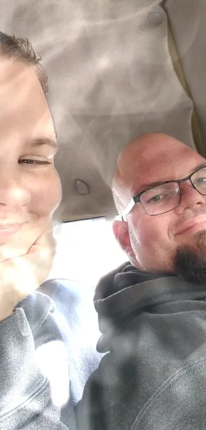 A joyful moment captured inside a car, showcasing smiles and warmth.