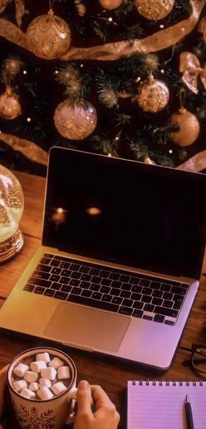 Cozy Christmas desk setup with laptop and festive decor.