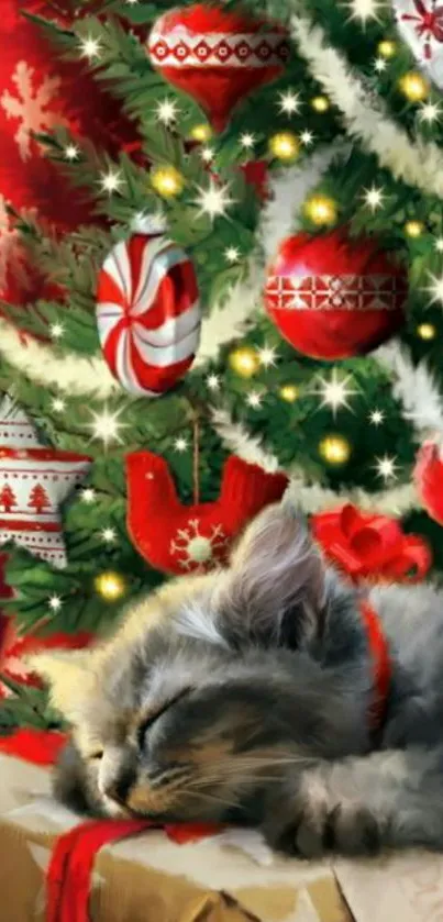 Sleeping kitten under decorated Christmas tree.