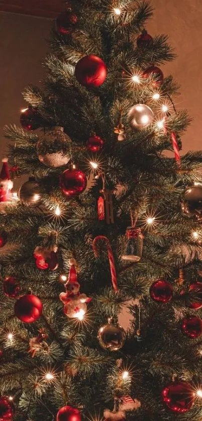 Cozy Christmas tree with red and silver ornaments and warm lights.