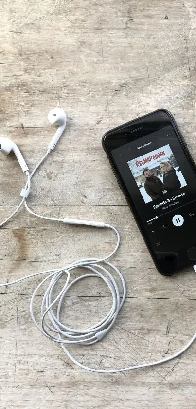 Smartphone, earbuds, and coffee on a wooden table with chocolate bars.