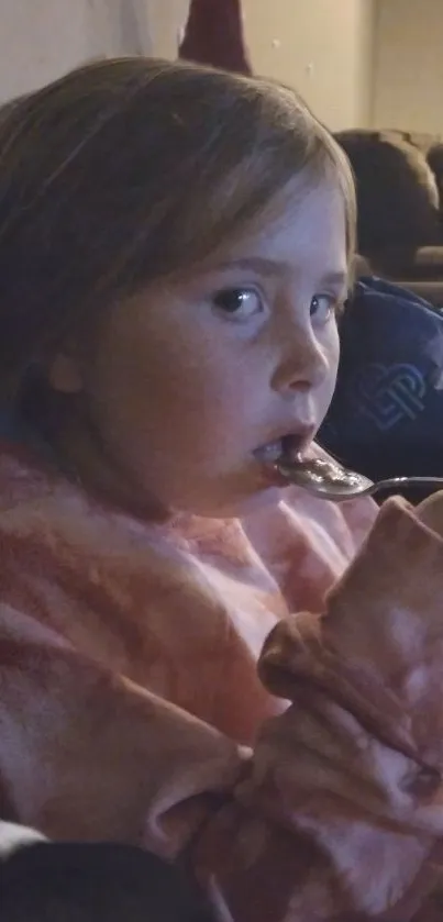 Child enjoying a cozy evening snack at home.