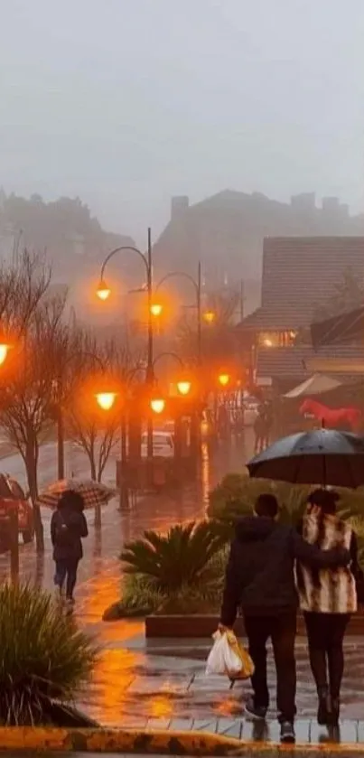 A couple walks on a rainy street illuminated by orange lamps.