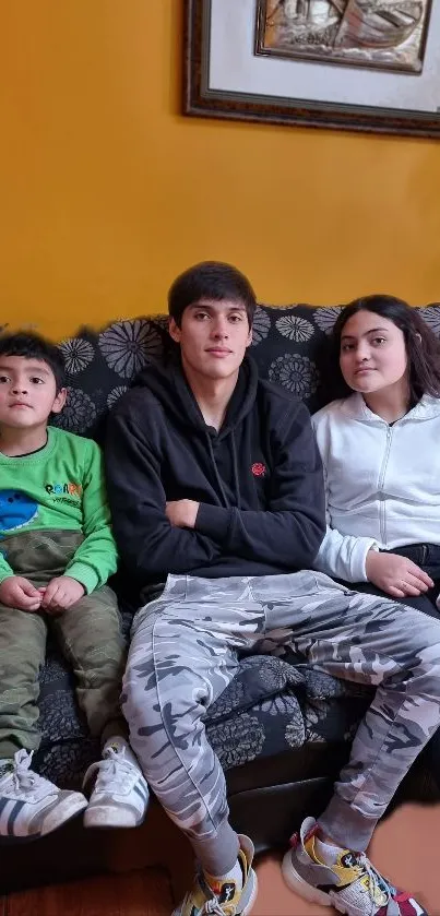 Children sitting together on a cozy couch at home.