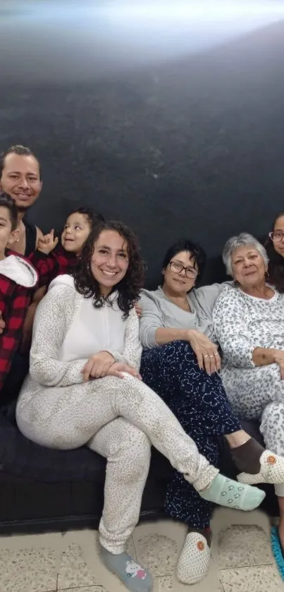 Family sitting together in pajamas.