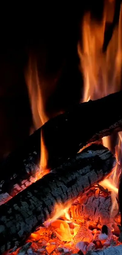 Mobile wallpaper of burning logs with vibrant orange flames.