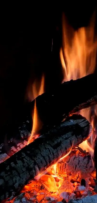 Cozy fireplace with glowing logs and flames for mobile wallpaper.