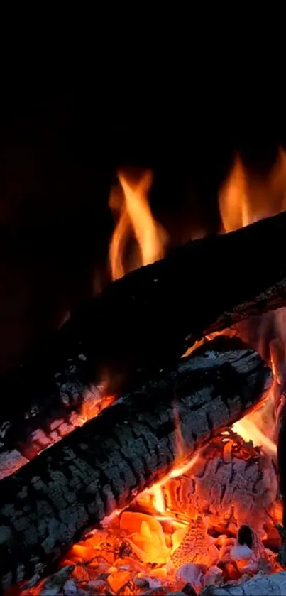 Mobile wallpaper showing a cozy fireplace with glowing embers and flames.