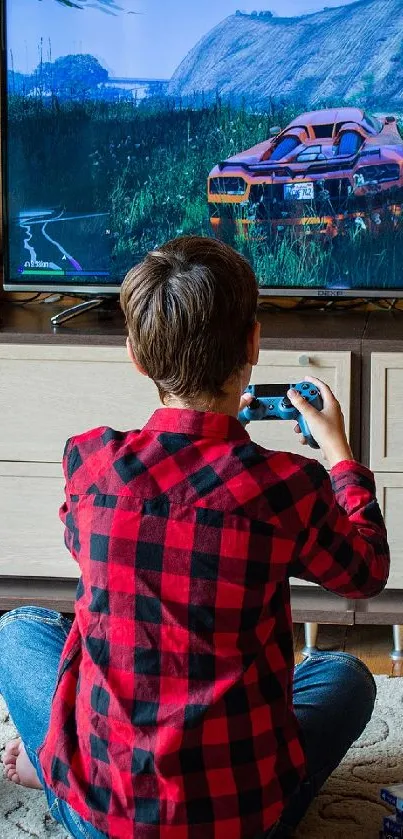 Boy gaming with console in cozy room wallpaper.